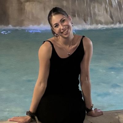 woman sitting in front of a fountain