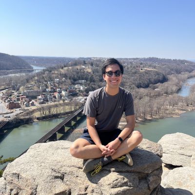 man sitting on a rock